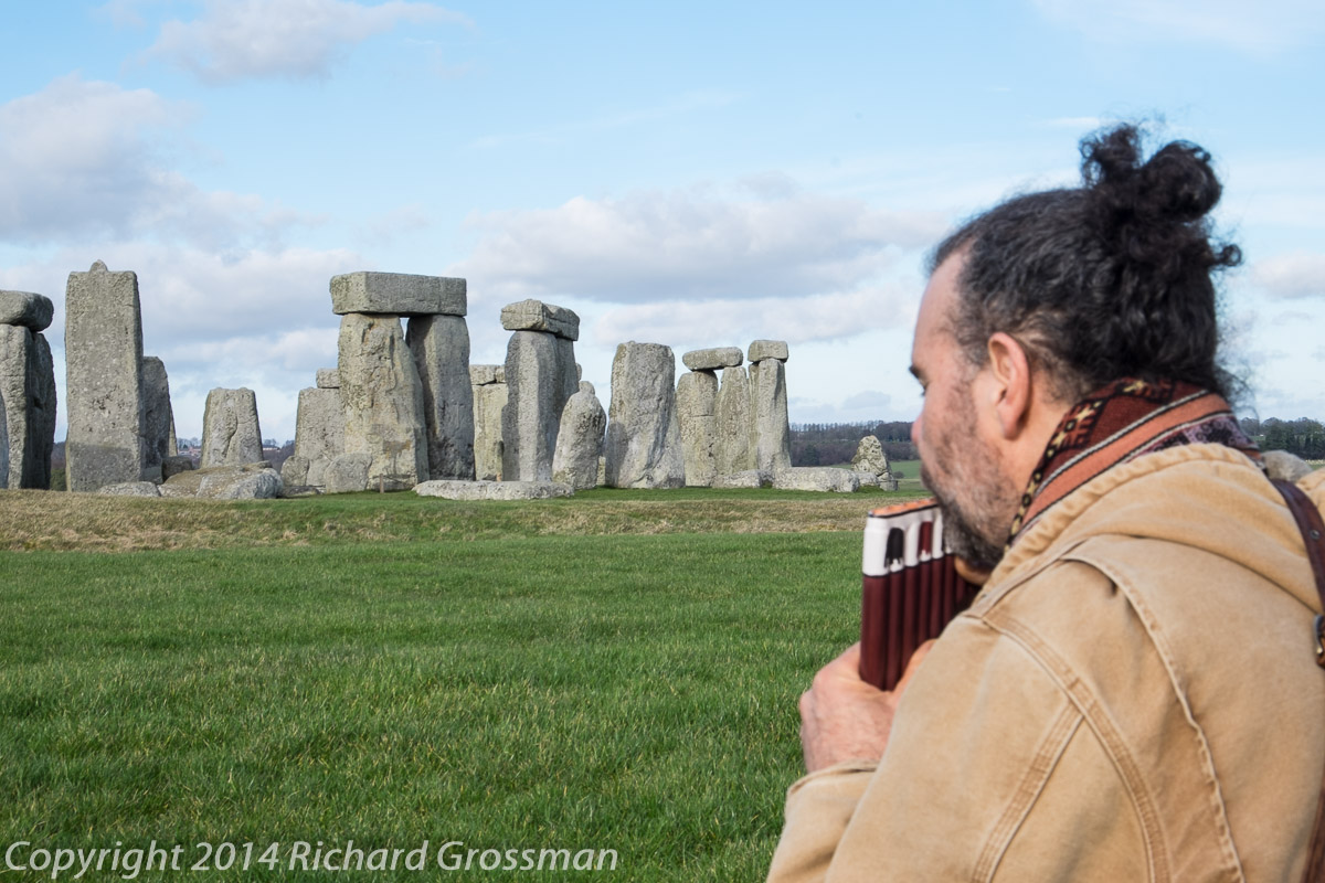 Richard Grossman playing music while facing Stonehenge